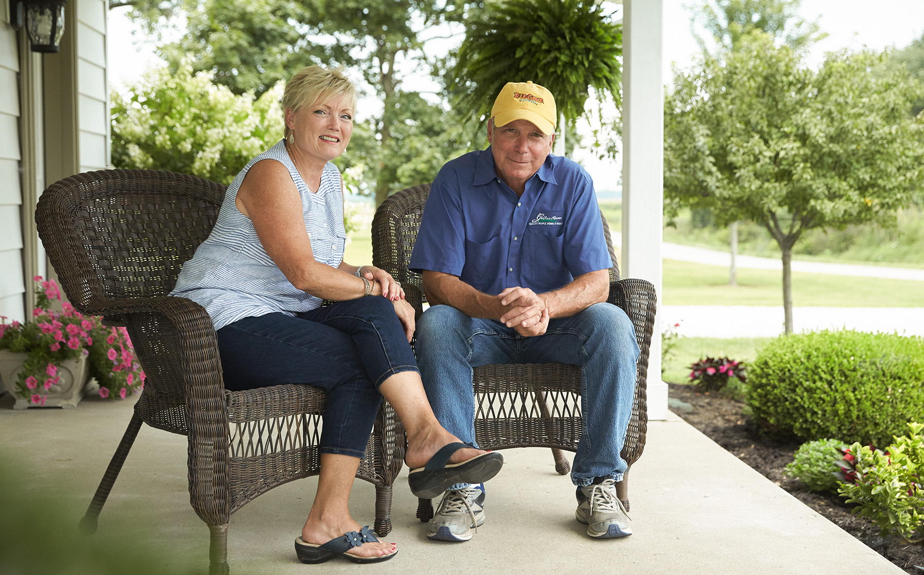 Image of Gelfius Family Farms Growers for Red Gold Tomatoes from Hartsville Indiana Bill and Norma Gelfius sitting in wicker chairs on front porch