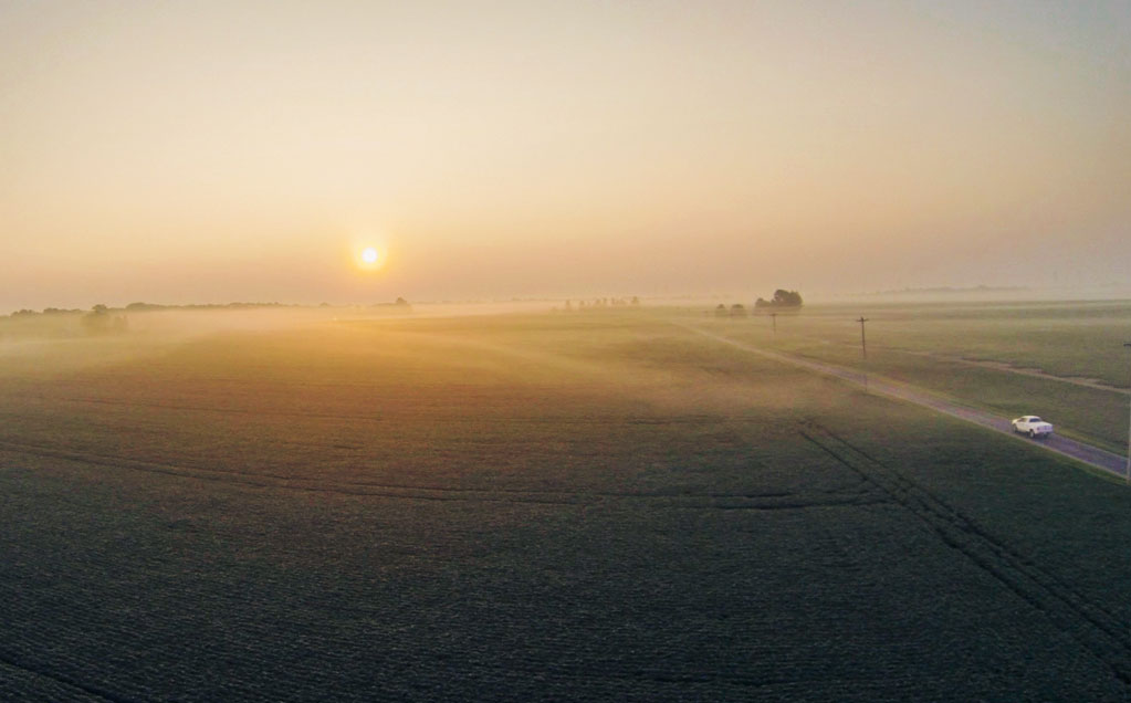 Image of Smith Farms Growers for Red Gold Tomatoes country road at sunset