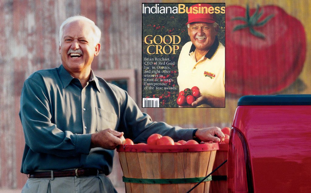 Image of Brian Reichart with bushel of tomatoes and Indiana Business magazine