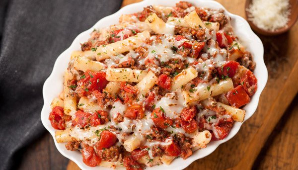 bakedziti Baked Ziti with Diced Tomatoes in oval white oven dish