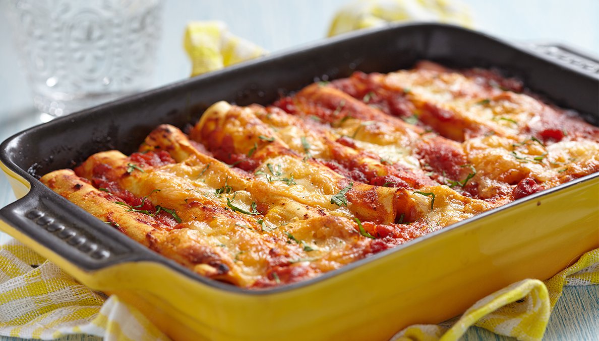 Image of Beef Enchiladas in a yellow casserole dish