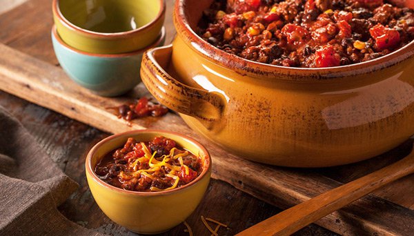 Image of Black Bean Chili in large crock with small bowls