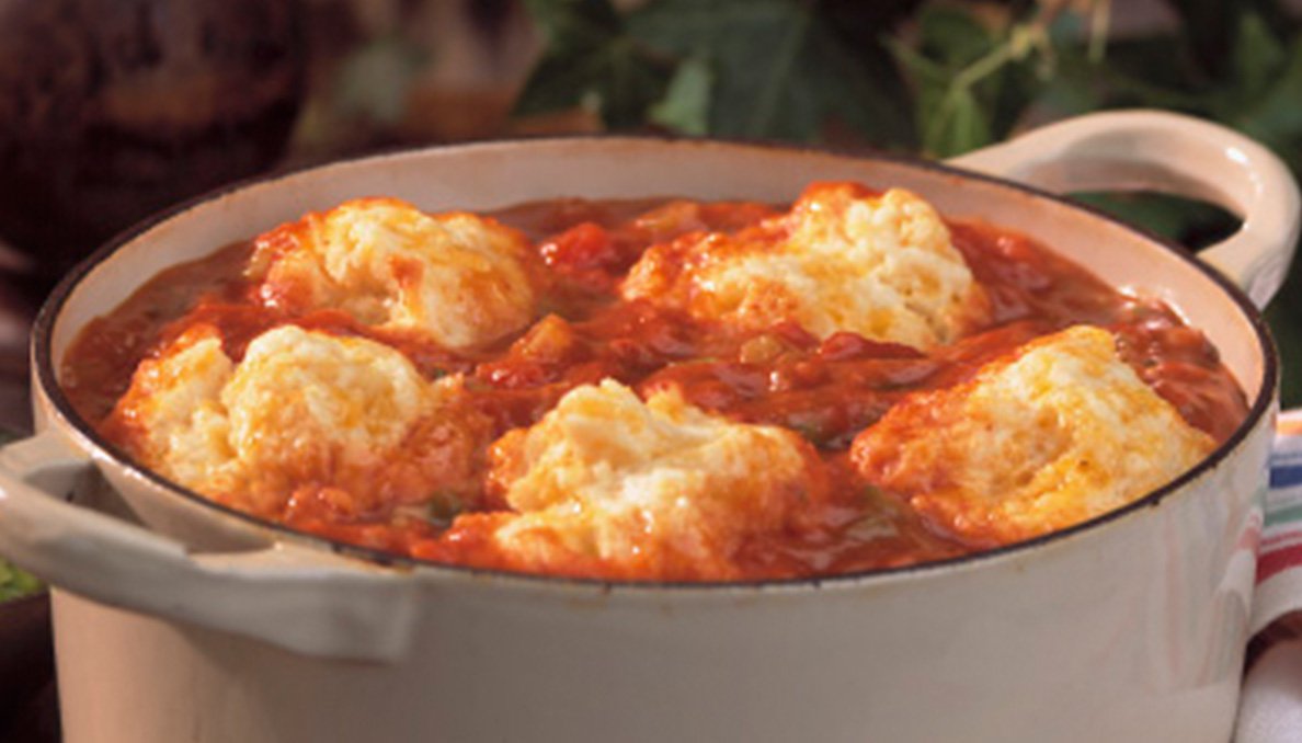 Image of Cheddar Tomato Dumplings in a Cast Iron Dutch Oven