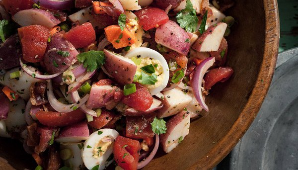 Confetti Potato Salad Zoomed Image of Confetti Potato Salad zoomed in on salad in wooden bowl
