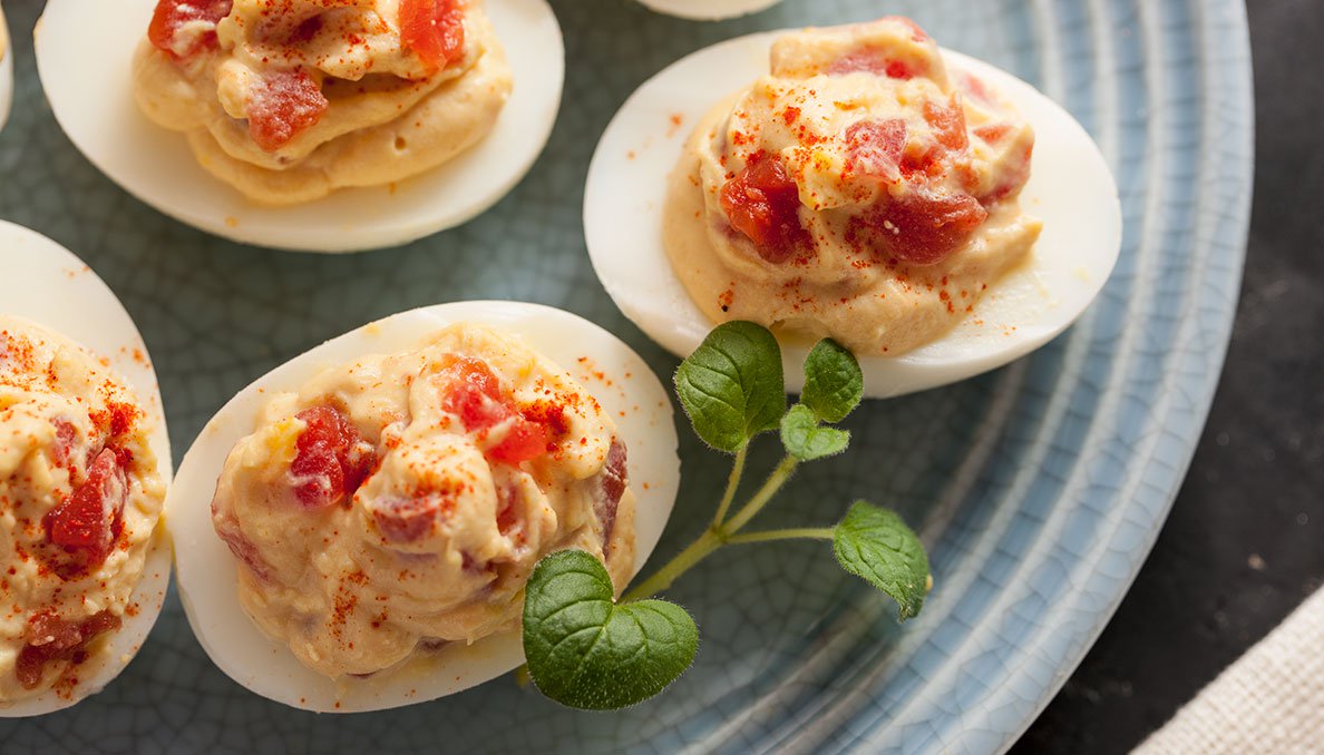 Ovrehead image of deviled eggs with petite diced tomatoes