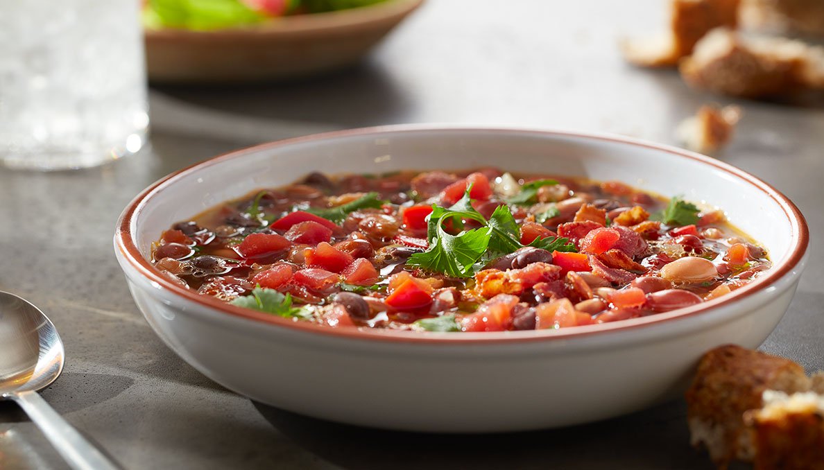 Image of savory bean soup in bowl using canned petite diced tomatoes