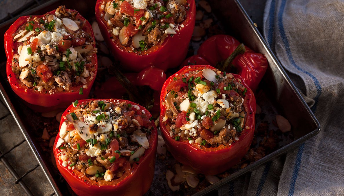 overhead image of Savory turkey stuffed bell peppers red bell peppers in oven dish