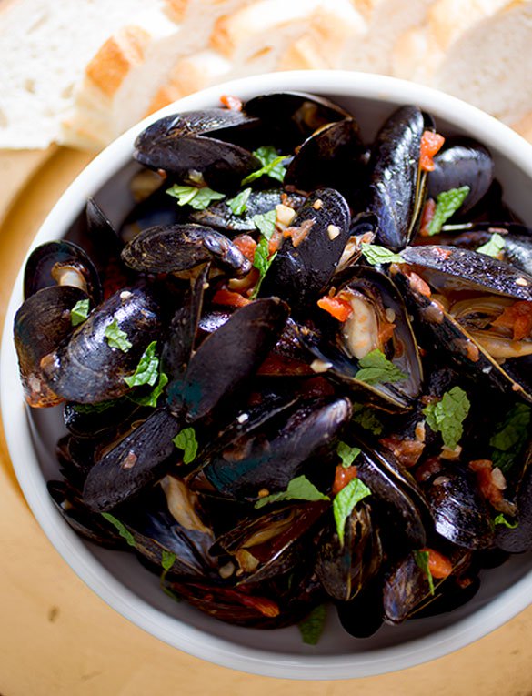 Pan-Seared Mussels with Tomatoes, Chilies and Mint by Chef Andrea Reusing