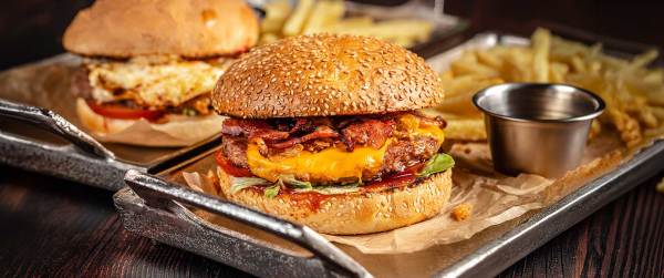 Double Bacon Cheeseburger with Bratwurst and French Fries